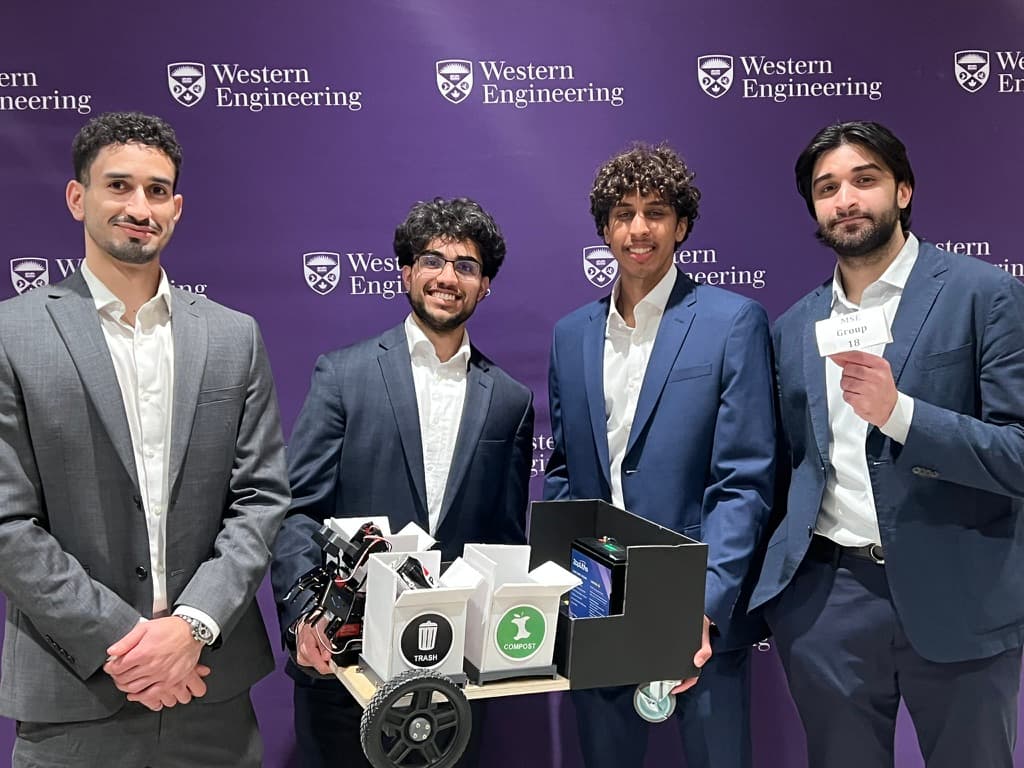 The RECLAIM capstone team of four with the prototype at the Western Engineering MSE 4499 showcase.